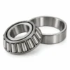 Tapered roller bearing and outer cup for an outboard motor gearbox